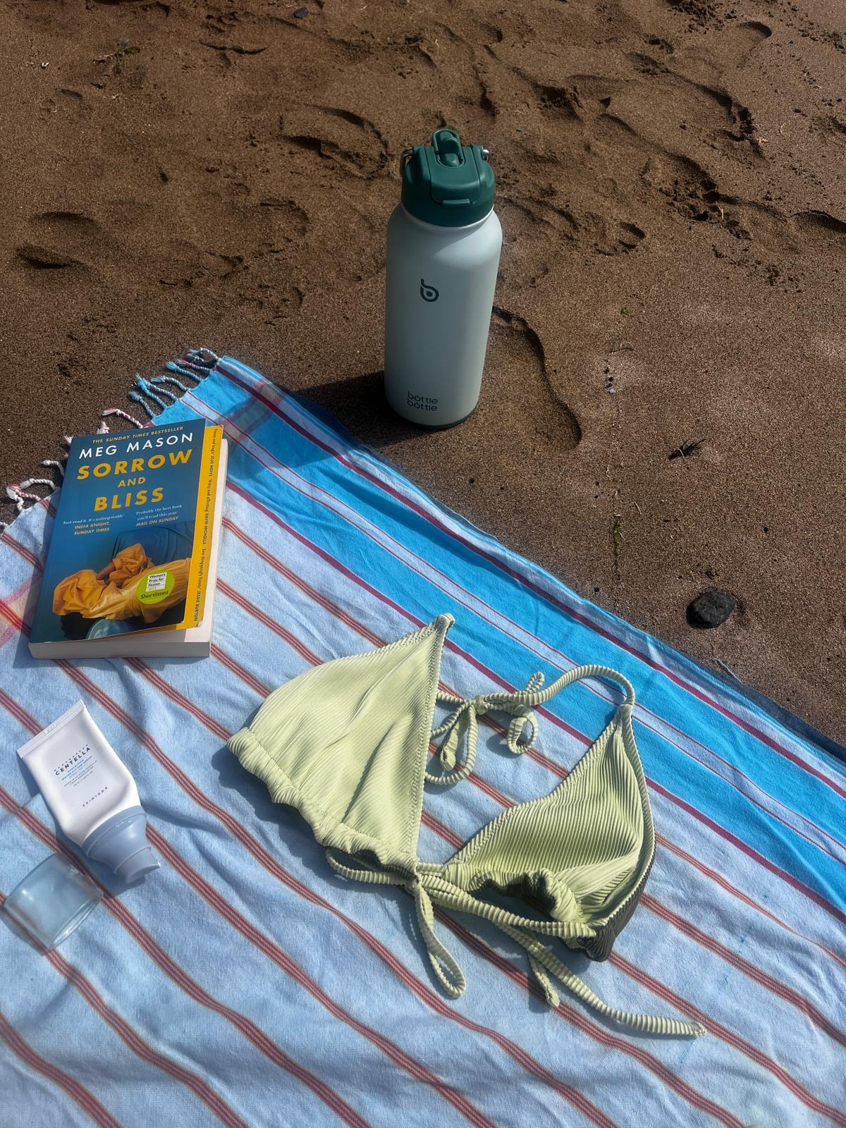Book on a towel at the beach
